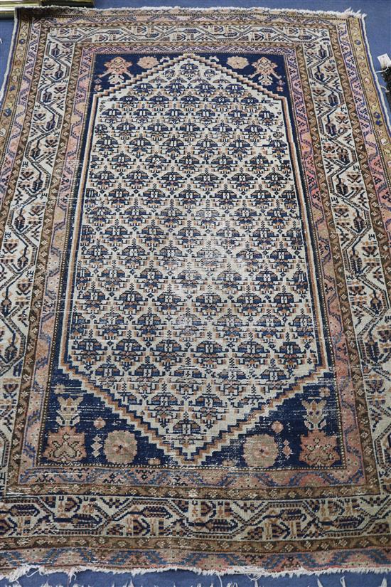 A Persian Hattchi style cream ground rug, 6ft 5in. x 4ft 3in.